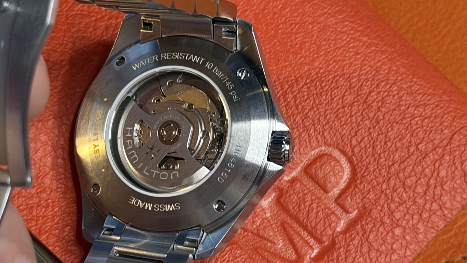 The back of the Hamilton Khaki Aviation Pilot Day Date case, the movement is visible through the transparent back