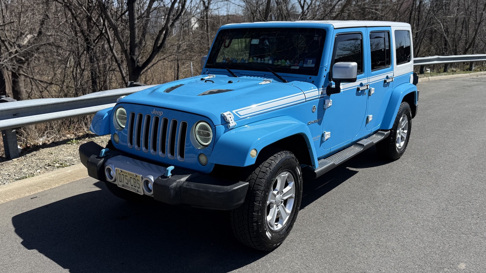 My freshly washed 2017 Jeep Wrangler Unlimited Chief Edition, in Chief Blue with a white top.