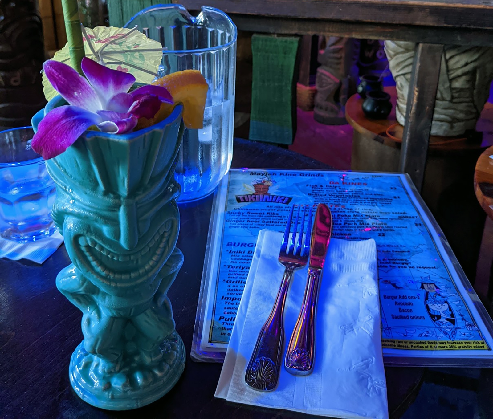 Tiki-Iniki My table at Tiki Iniki featuring an ornate green tiki mug.